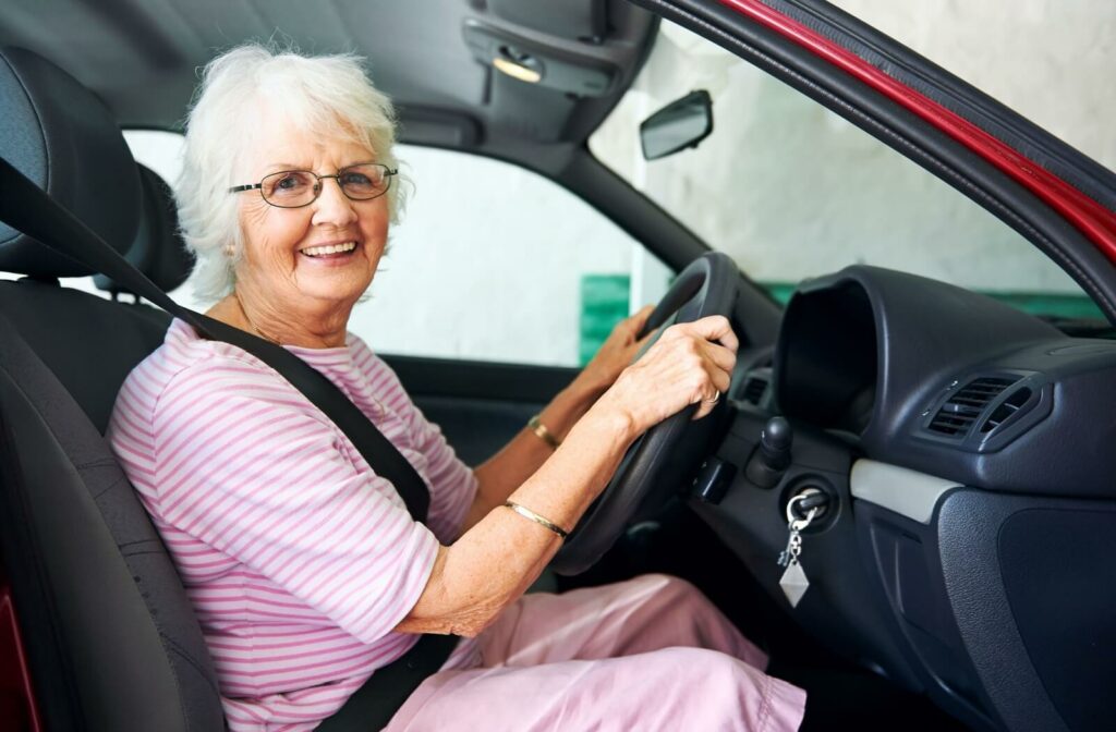 a senior woman driving a car