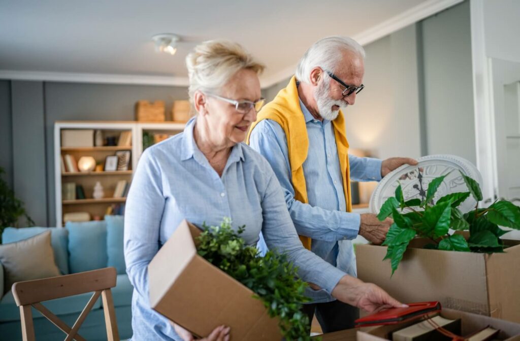 A senior couple unpacks in their beautiful memory care apartment.